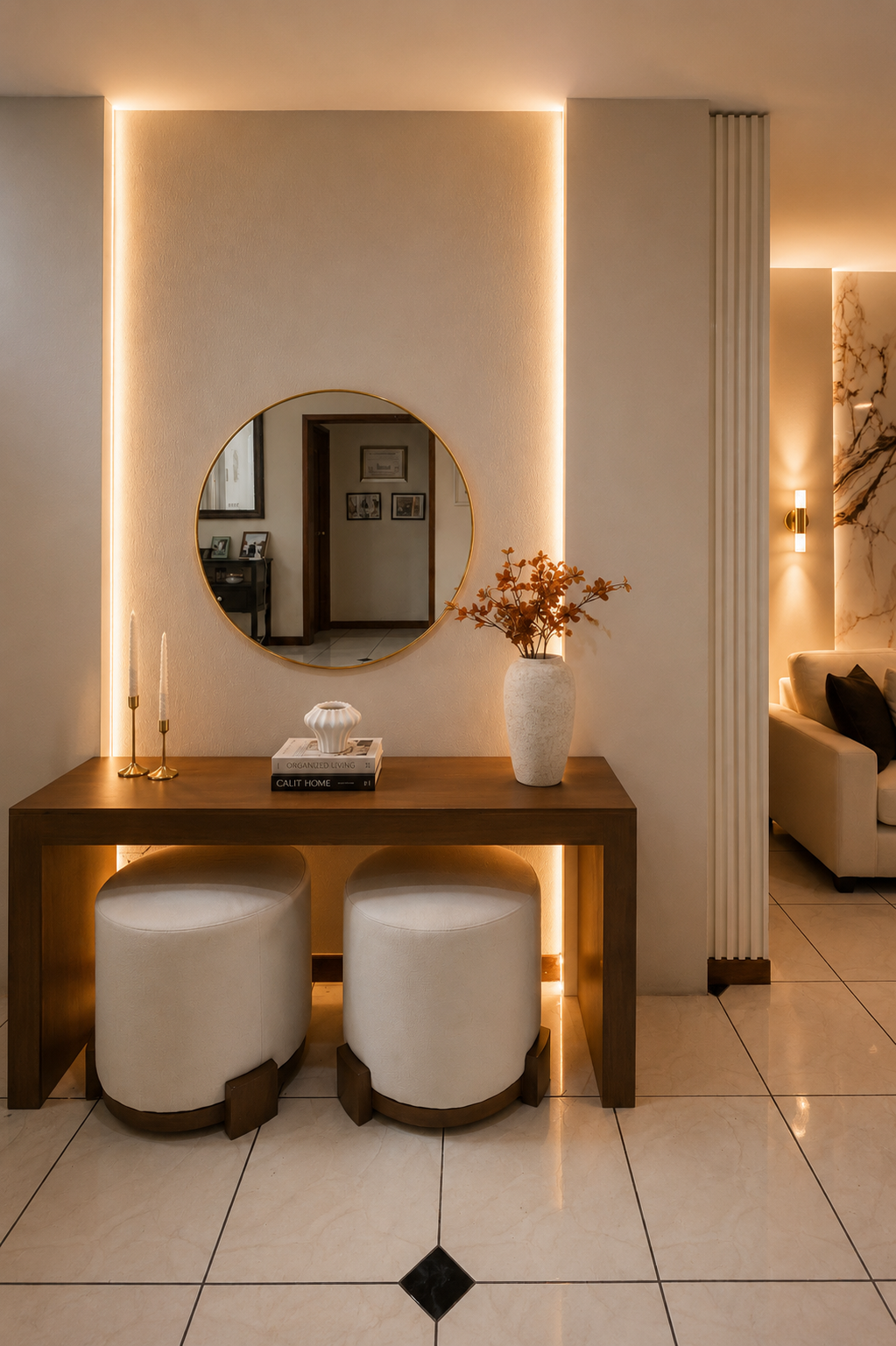 Casa Ámbar — recibidor con consola de madera, espejo circular y taburetes
